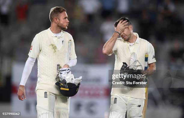 England batsmen Stuart Broad and James Anderson leave the field after Anderson was the last man out and New Zealand win the match during day five of...