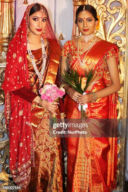 Models wearing elegant bridal sarees during the Amrapali 2018 fashion exhibition held in Markham, Ontario, Canada on March 11, 2018.