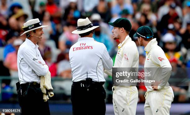 Umpires chatting with Cameron Bancroft and Steven Smith of Australia during day 3 of the 3rd Sunfoil Test match between South Africa and Australia at...