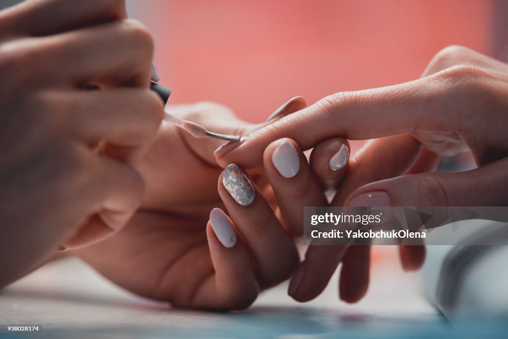 Apply Lacquer Woman Master Arm Applying Lacquer In Salon High-Res Stock Photo - Getty ...