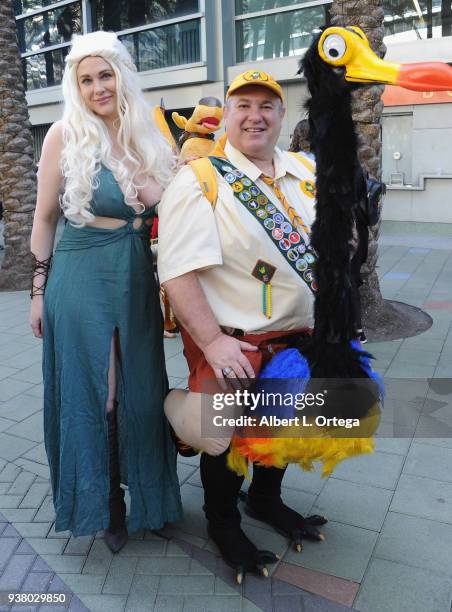 Actress Maitland Ward poses with a cosplayer dressed as Russell from Disney's 'Up' on day 3 of WonderCon 2018 held at Anaheim Convention Center on...