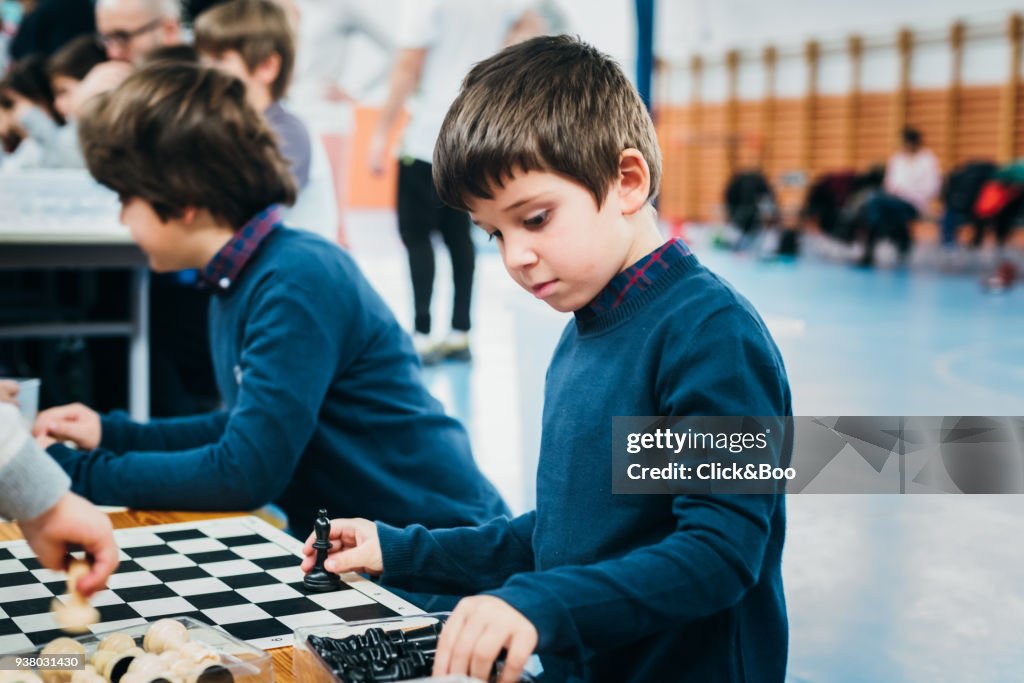 Brothers playing chess