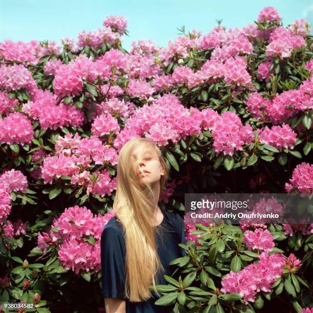 Portrait of beautiful young woman in flowers