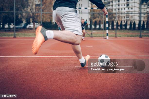 soccer player - street football stock-fotos und bilder