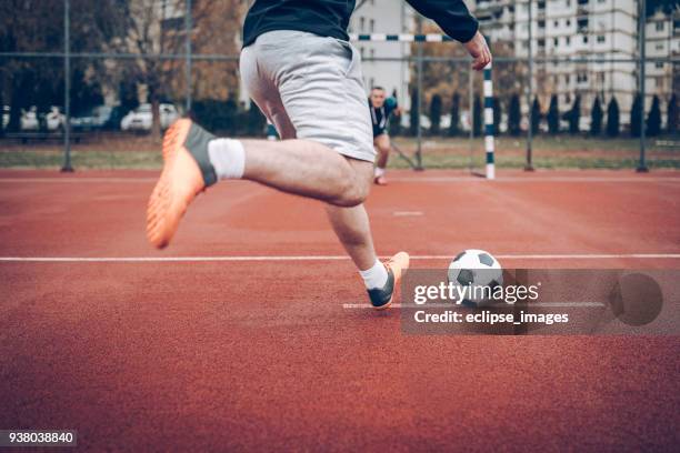 soccer player - street football stock pictures, royalty-free photos & images