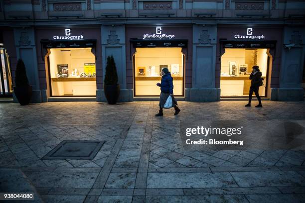 Shoppers walk past a Chronograph watch store in Tbilisi, Georgia, on Friday, March 23, 2018. Georgias gross domestic product grew at a rate of 5.4...