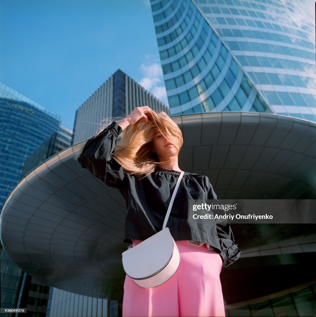 Portrait of beautiful young woman in city