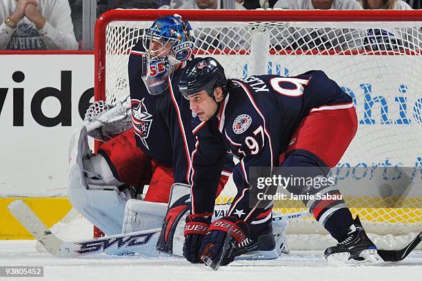 Defenseman Rostislav Klesla of the Columbus Blue Jackets and goaltender Steve Mason of the Columbus Blue Jackets defend the net against the Calgary...