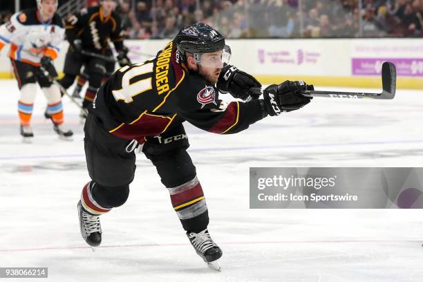 Cleveland Monsters left wing Jordan Schroeder shoots the puck during the second period of the American Hockey League game between the San Diego Gulls...