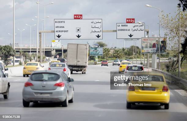 March 05: Vehicles drive on a multi-lane road. Street scene in Tunis on March 05, 2018 in TUNIS, TUNISIA.