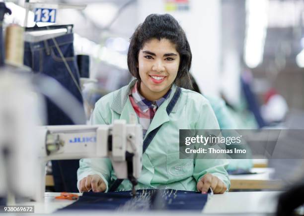 January 01: Training workshop of the textile company Sartex. A young woman is sewing on January 01, 2000 in KSAR HELLAL, TUNISIA.