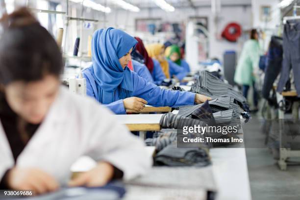 January 01: Training workshop of the textile company Sartex. Seamstresses at work on January 01, 2000 in KSAR HELLAL, TUNISIA.