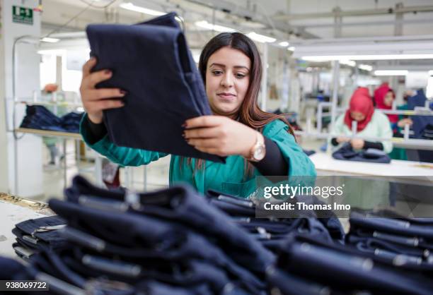 January 01: Training workshop of the textile company Sartex. Young women work in the final assembly on January 01, 2000 in KSAR HELLAL, TUNISIA.