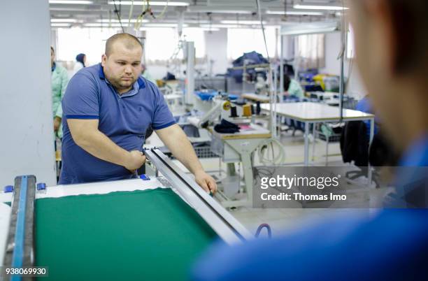 January 01: Salem Fadhloun at work in the training workshop of the textile company Sartex on January 01, 2000 in KSAR HELLAL, TUNISIA. Salem Fadhloun...