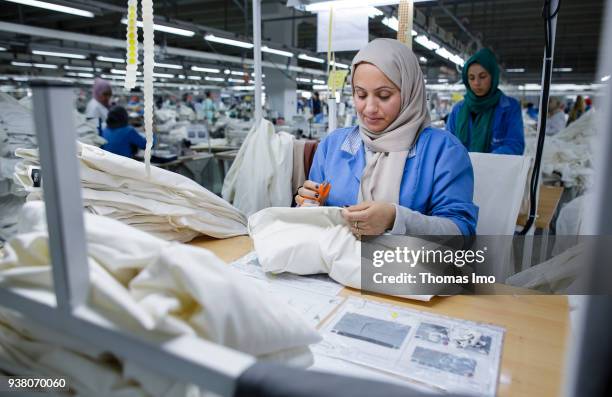 January 01: Production hall of the textile company Sartex. Employees at work on January 01, 2000 in KSAR HELLAL, TUNISIA.