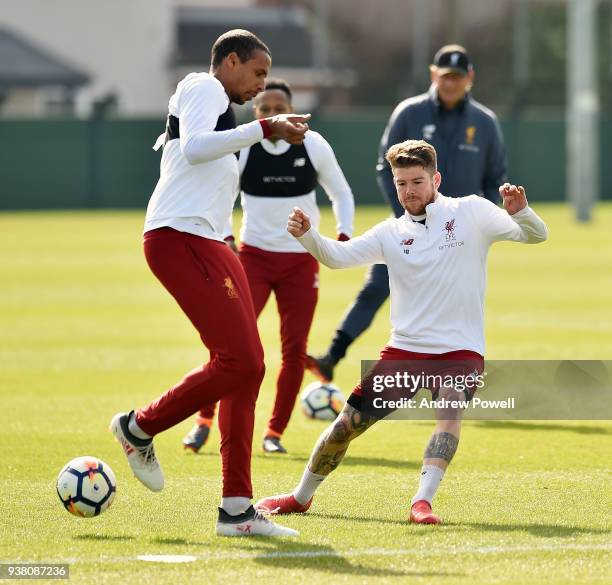 Alberto Moreno and Joel Matip of Liverpool during a training session at Melwood training ground on March 26, 2018 in Liverpool, England.