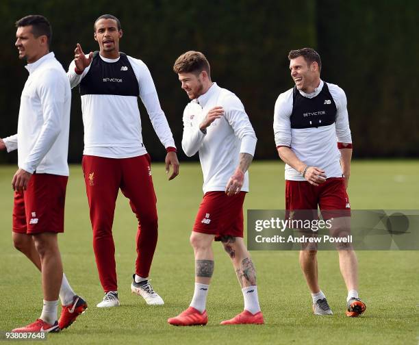 Joel Matip, Alberto Moreno and James Milner of Liverpool during a training session at Melwood training ground on March 26, 2018 in Liverpool, England.