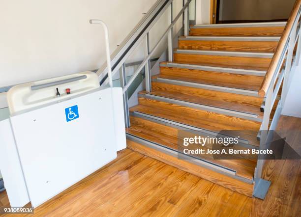 elevator to raise stairs you persons with wheelchair, stairlift for the disabled. - wheelchair accessibility stock pictures, royalty-free photos & images