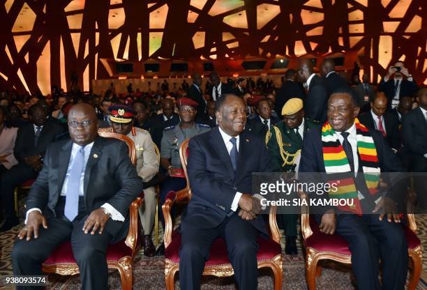 Ghanaian President Nana Akufo-Addo , Ivorian President Alassane Ouattara and Zimbabwe's President Emmerson Mnangagwa attend the opening session of...