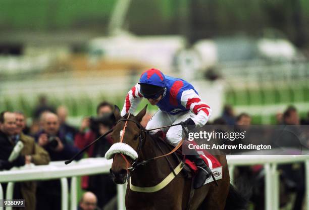 Richard Johnson and Looks Like Trouble on their way to victory in the Cheltenham Gold Cup Steeple Chase at the Cheltenham National Hunt Festival at...