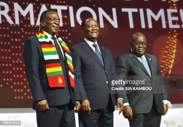 Ivorian President Alassane Ouattara , Zimbabwe's President Emmerson Mnangagwa , Ghanaian President Nana Akufo-Addo pose at the end of the opening...