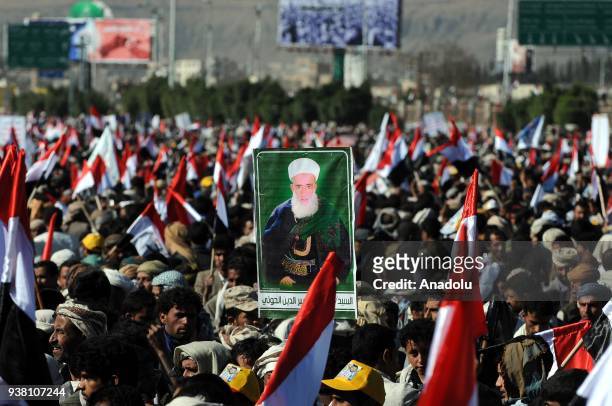 Houthis gather to protest the Saudi-led operations during a rally on the third anniversary of the Operation Decisive Storm at al-Sabin Square in...