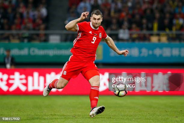 Sam Vokes of Wales shoots the ball during the 2018 China Cup International Football Championship match between Wales and Uruguay at Guangxi Sports...