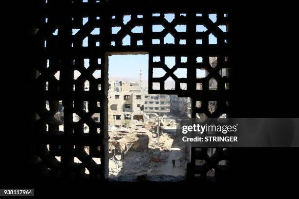 Picture shows destruction in the town of Harasta in Eastern Ghouta, on the outskirts of the Syrian capital Damascus, on March 26, 2018. Five weeks...