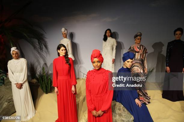 World's first hijab wearing US-Somali model Halima Aden and other models pose for a photo ahead of fashion designer Rasit Bagzibagli's 2018...