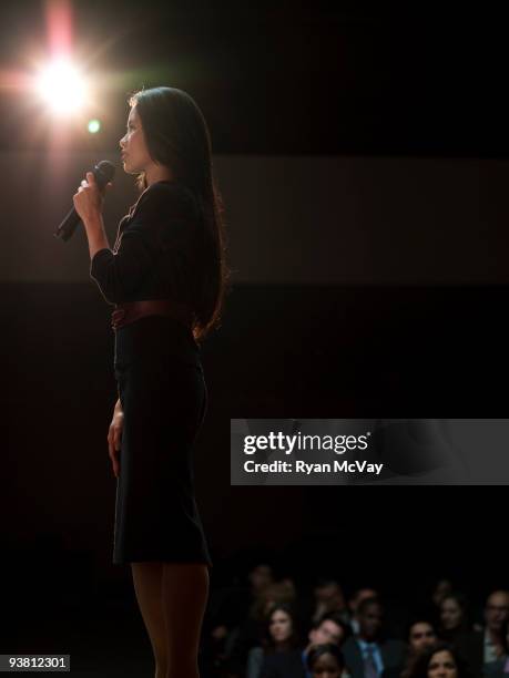 woman making speech to crowd - holding microphone stock pictures, royalty-free photos & images