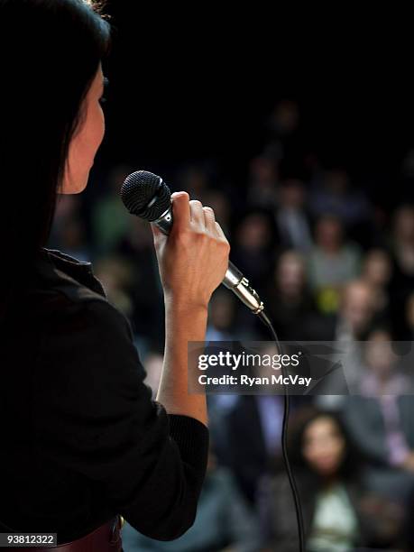business woman speaking to crowd - speech stockfoto's en -beelden