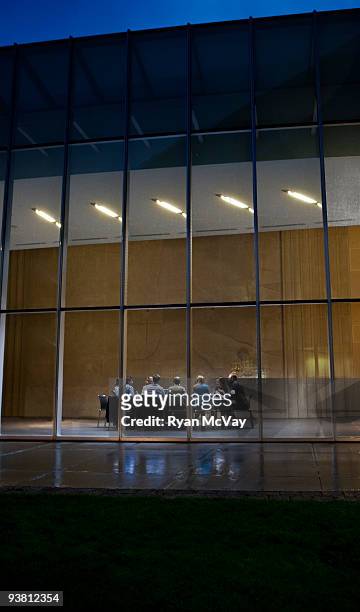 business group working around conference table - conference table stock pictures, royalty-free photos & images