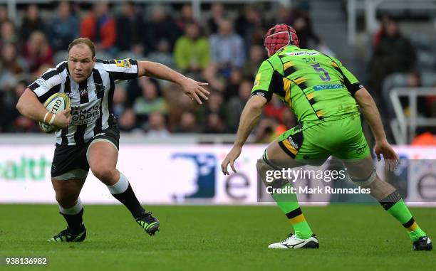 Kyle Cooper of Newcastle Falcons takes on Christian Day of Northampton Saints during the Aviva Premiership match between Newcastle Falcons and...