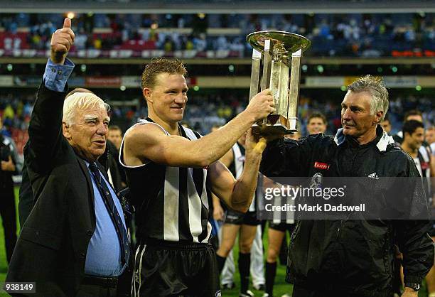 Retiring RSL President Bruce Ruxton presents Nathan Buckley and Captain of Collingwood and Mick Malthouse coach of Collingwood with the RSL Anzac Day...