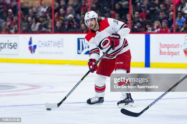 Carolina Hurricanes Center Elias Lindholm passes the puck during first period National Hockey League action between the Carolina Hurricanes and...