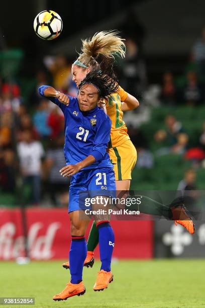 Kanjana Sung-Ngoen of Thailand and Ellie Carpenter of the Matildas contest for a header during the International Friendly Match between the...