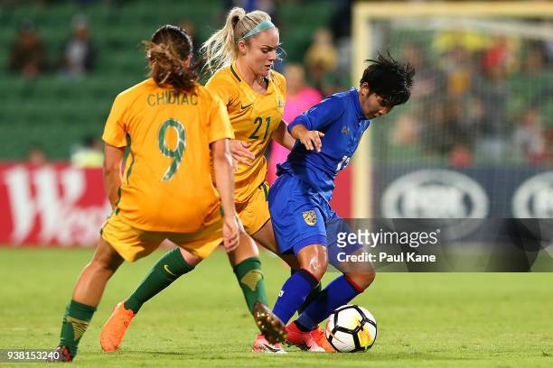 Orata Srimanee of Thailand is challenged by Ellie Carpenter of the Matildas during the International Friendly Match between the Australian Matildas...