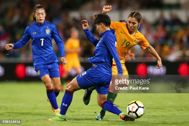Natthakarn Chinwong of Thailand and Katrina-Lee Gorry of the Matildas contest for the ball during the International Friendly Match between the...
