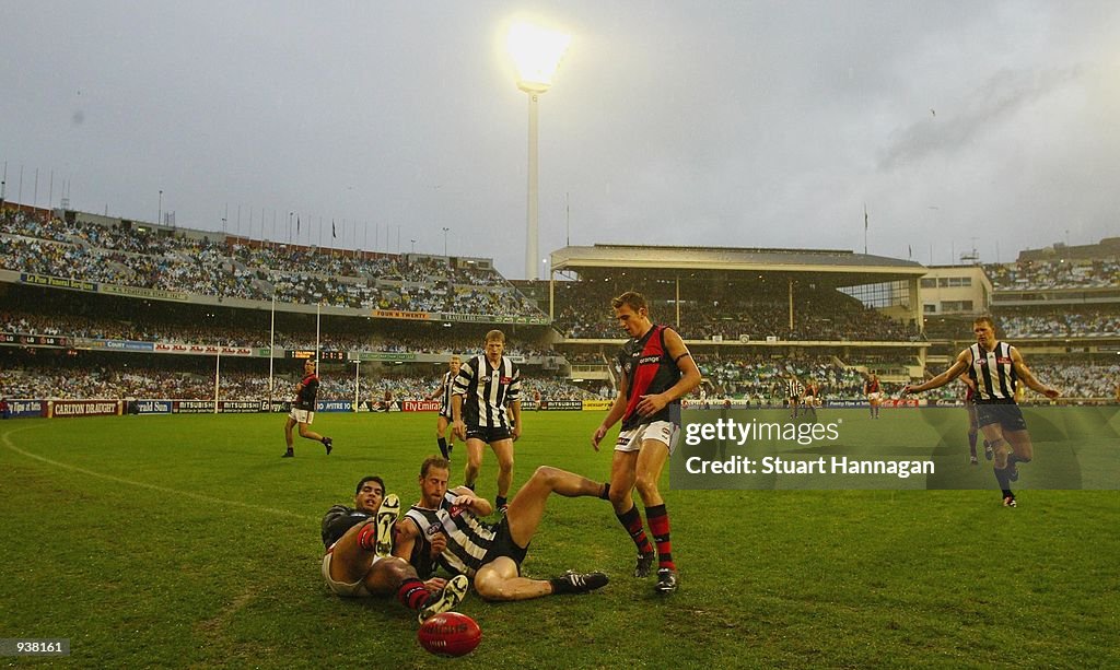 Essendon Rioli Dean Rioli of Essendon and Carl Steinfort for Collingwood slide out ...