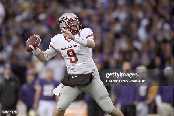 Quarterback Kevin Lopina of the Washington State Cougars passes the ball during the game against the Washington Huskies on November 28, 2009 at Husky...