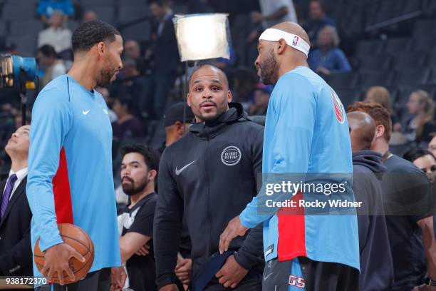 Jameer Nelson of the Detroit Pistons talks with Garrett Temple and Vince Carter of the Sacramento Kings prior to the game on March 19, 2018 at Golden...