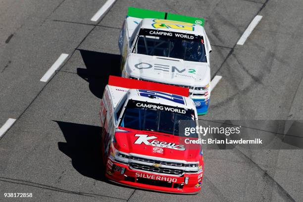 Austin Wayne Self, driver of the Kreuz Market/Don't Mess With Texas Chevrolet, leads Reid Wilson, driver of the OEM2 Powered by TruNorth Chevrolet,...