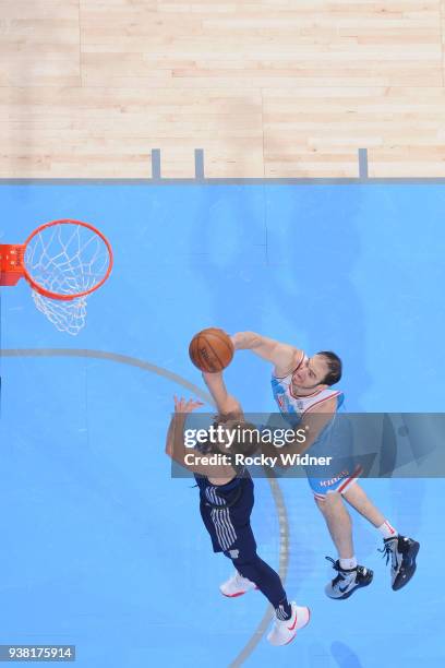 Luke Kennard of the Detroit Pistons shoots against Kosta Koufos of the Sacramento Kings on March 19, 2018 at Golden 1 Center in Sacramento,...