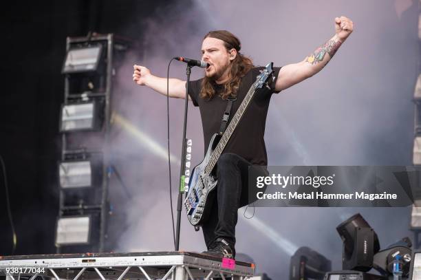 Bassist and vocalist Aaron Pauley of American metalcore group Of Mice And Men performing live on stage at Download Festival in Castle Donington,...