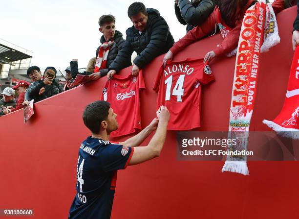 Xabi Alonso of FC Bayern Legends signing autographs after the LFC Foundation charity match between Liverpool FC Legends and FC Bayern Legends at...