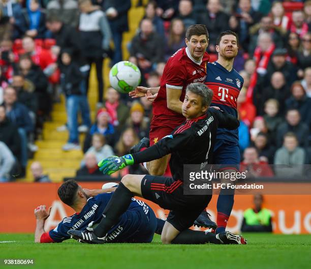 Steven Gerrard of Liverpool goes for goal as Xabi Alonso of FC Bayern Legends defends during the LFC Foundation charity match between Liverpool FC...