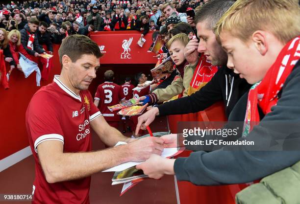 Steven Gerrard of Liverpool signing autographs after the LFC Foundation charity match between Liverpool FC Legends and FC Bayern Legends at Anfield...