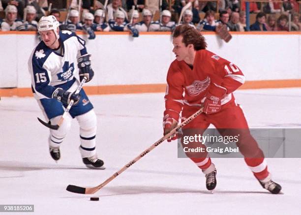 Bob McGill of the Toronto Maple Leafs skates against Ron Duguay of the Detroit Red Wings during NHL game action on March 1, 1986 at Maple Leafs...