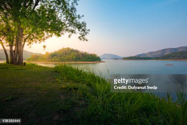 countryside landscape with mountain and swamp in summer. - lake sunrise stock pictures, royalty-free photos & images