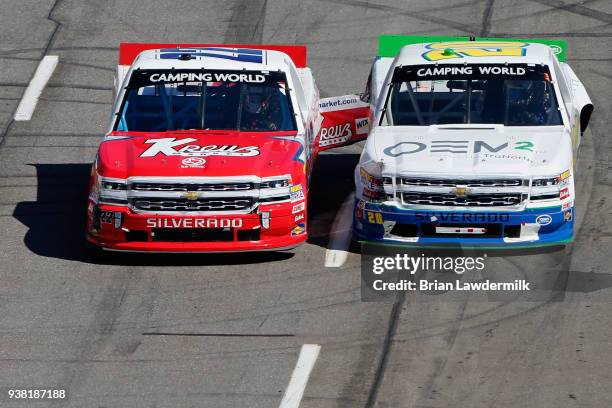 Austin Wayne Self, driver of the Kreuz Market/Don't Mess With Texas Chevrolet, and Reid Wilson, driver of the OEM2 Powered by TruNorth Chevrolet,...